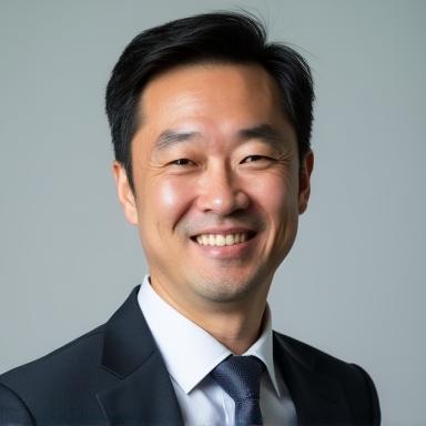 執行役員 佐藤 健司のプロフェッショナルな顔写真